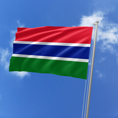 Gambia flag fluttering in the wind on sky.