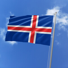 Iceland flag fluttering in the wind on sky.