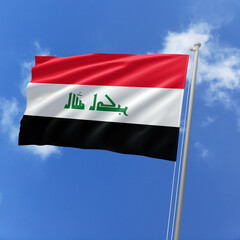 Iraq flag fluttering in the wind on sky.
