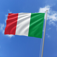 Italy flag fluttering in the wind on sky.
