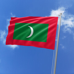 Maldives flag fluttering in the wind on sky.