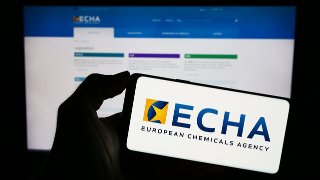 Stuttgart, Germany - 10-20-2023: Person holding cellphone with logo of EU institution European Chemicals Agency (ECHA) in front of webpage. Focus on phone display.