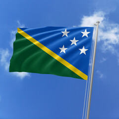 Solomon Islands flag fluttering in the wind on sky.