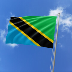 Tanzania flag fluttering in the wind on sky.