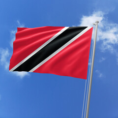 Trinidad and Tobago flag fluttering in the wind on sky.