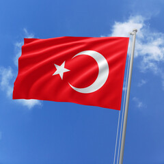 Turkey flag fluttering in the wind on sky.