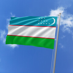 Uzbekistan flag fluttering in the wind on sky.