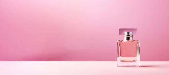 Poster blank bottle of luxury perfume in pink soft pastel color © dashtik