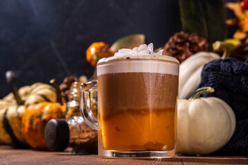 Pumpkin spice latte in a glass mug