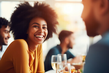 African American family having dinner during thanksgiving day. Happy people celebrating holiday, eating and laughing together
