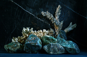 Still life with green stones and corals.