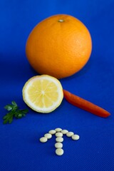 Arrow of vitamin C pills directing to a lemon