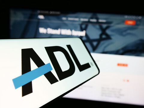 Stuttgart, Germany - 10-27-2023: Cellphone with logo of civil rights organisation Anti-Defamation League (ADL) in front of website. Focus on center-left of phone display.