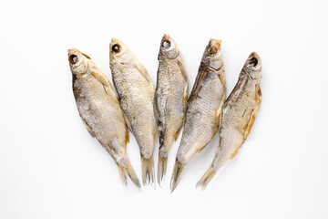 Dried salted fish jerked roach on isolated white background top view for your design. Healthy food. Protein, Vitamins, healthy fats for human health. Bio products. Food, homemade beer snack