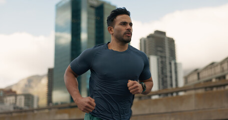 Exercise, running and a sports man in the city for cardio training to improve fitness for a...