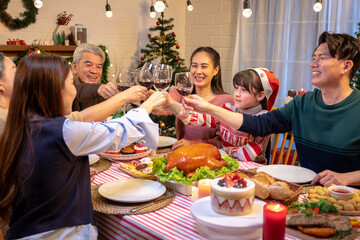 Happy people are celebrating on a table meal when christmas and new year at home.