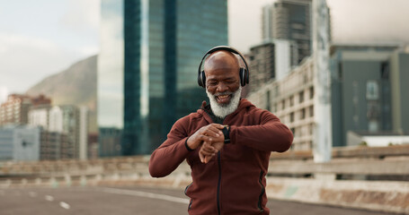 Man, music and smart watch in city for exercise, fitness performance and workout results. Happy...