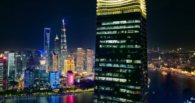 Aerial view of Shanghai skyline and skyscrapers scenery at night, China. Famous city landmarks in China. Drone surround shooting.