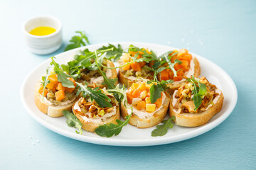 Healthy crostini with pumpkin and mushroom