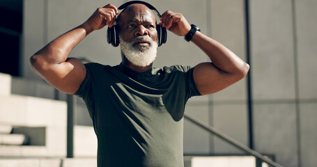 Fitness, music headphones and black man on stairs in city, workout and exercise for body health. Radio, steps and senior athlete in urban town, listening to audio sound and serious, thinking or relax