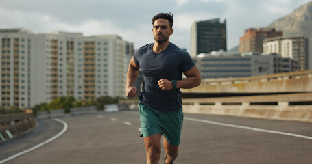 Running, city and man on road in training, endurance and fitness lifestyle for marathon competition. Indian runner, exercise commitment and body wellness for cape town race, progress and urban sport - obrazy, fototapety, plakaty