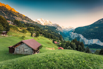 Wengen village and Lauterbrunnen valley with Jungfrau mountain in the evening at Bern, Switzerland - obrazy, fototapety, plakaty