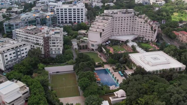 Aerial video of luxe hotel is 2 km from the Khairatabad Railway Station and 7 km from the Salar Jung Museum. Shows swimming pool and old model buildings.