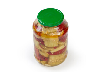 Canned pieces of eggplant with bell pepper in glass jar
