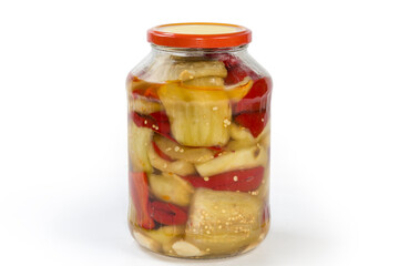 Canned eggplant with bell pepper in glass jar, side view