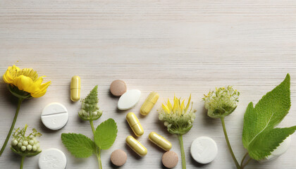 Various pills, herbal remedies, and blossoms laid out on a white wooden surface, top view with room for text. Nutritional supplements - obrazy, fototapety, plakaty
