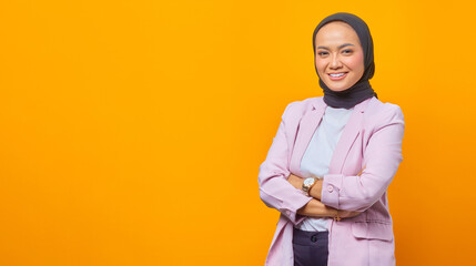 Smiling Asian business woman crossing her arms in business suit