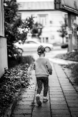 little child walking on the street
