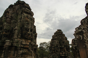 Fototapeta na wymiar Faces of ancient Bayon Temple in Angkor Wat, Siem Reap, Cambodia