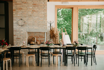 Flower decoration for celebrations. Decoration of tables and chairs. Rustic decoration.

