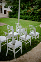 Flower decoration for celebrations. Decoration of tables and chairs. Rustic decoration.

