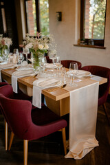 Flower decoration for celebrations. Decoration of tables and chairs. Rustic decoration.

