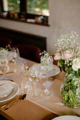 Flower decoration for celebrations. Decoration of tables and chairs. Rustic decoration.

