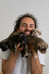 Proud dog owner with puppies