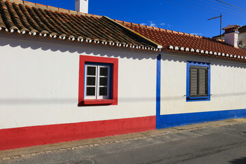 Fototapeta na wymiar Narrow streets and white houses of Longueira town in Portugal