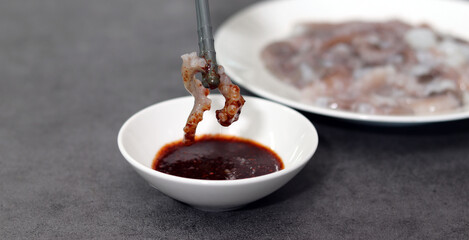 Eat fresh octopus sashimi. Fresh seafood and spicy sauce.
