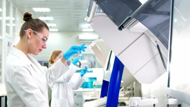 A team of scientists working and analyzing trial data for new generation drugs. They work in a modern laboratory/medical center.