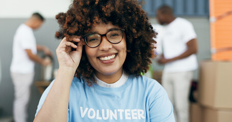 Volunteer woman, portrait and smile for charity, clothes drive and community service with kindness...