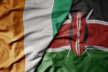 Fototapeta premium big waving national colorful flag of cote divoire and national flag of kenya .