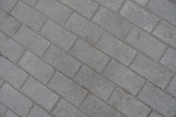 Texture of running bond brick like gray concrete pavement
