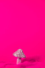 Merry Christmas. Christmas banner in pink color on a pink Christmas background. Christmas background, pink xmas holiday card. Christmas card pink balls pinkmas