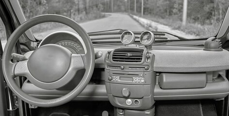 Car steering wheel and interior background, modern city car elements close view. Car inside interior