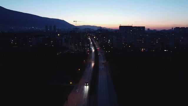 Drone flight over Boulevard Andrey Lyapchev in Sofia, Bulgaria at dusk