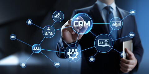 CRM Customer relationship management concept. Businessman pressing button on screen.