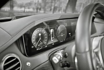 Car steering wheel with car dashboard computer and interior background, modern city car elements...
