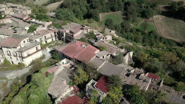 Drone view of an old abandoned ghost town and houses with destroyed roofs. Village of old Apice (Borgo di Apice Vecchia)